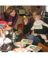 baby playing with balloon